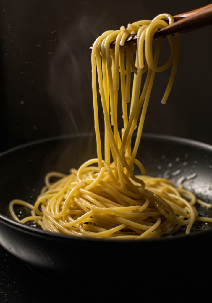 Simmering tomato water with pasta